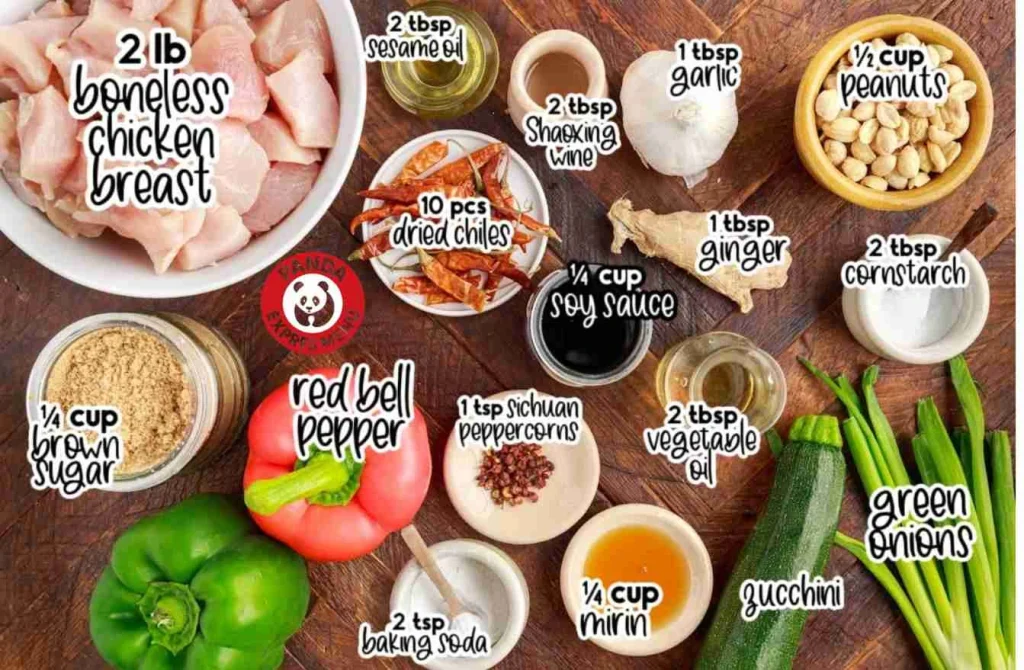 "Flat lay of fresh ingredients for Panda Express Kung Pao Chicken, including boneless chicken breast, red bell pepper, peanuts, soy sauce, sesame oil, dried chilies, and more, labeled for easy reference."